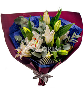 bouquet of lilies with greenery
