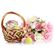 easter cake and eggs in a basket with flowers